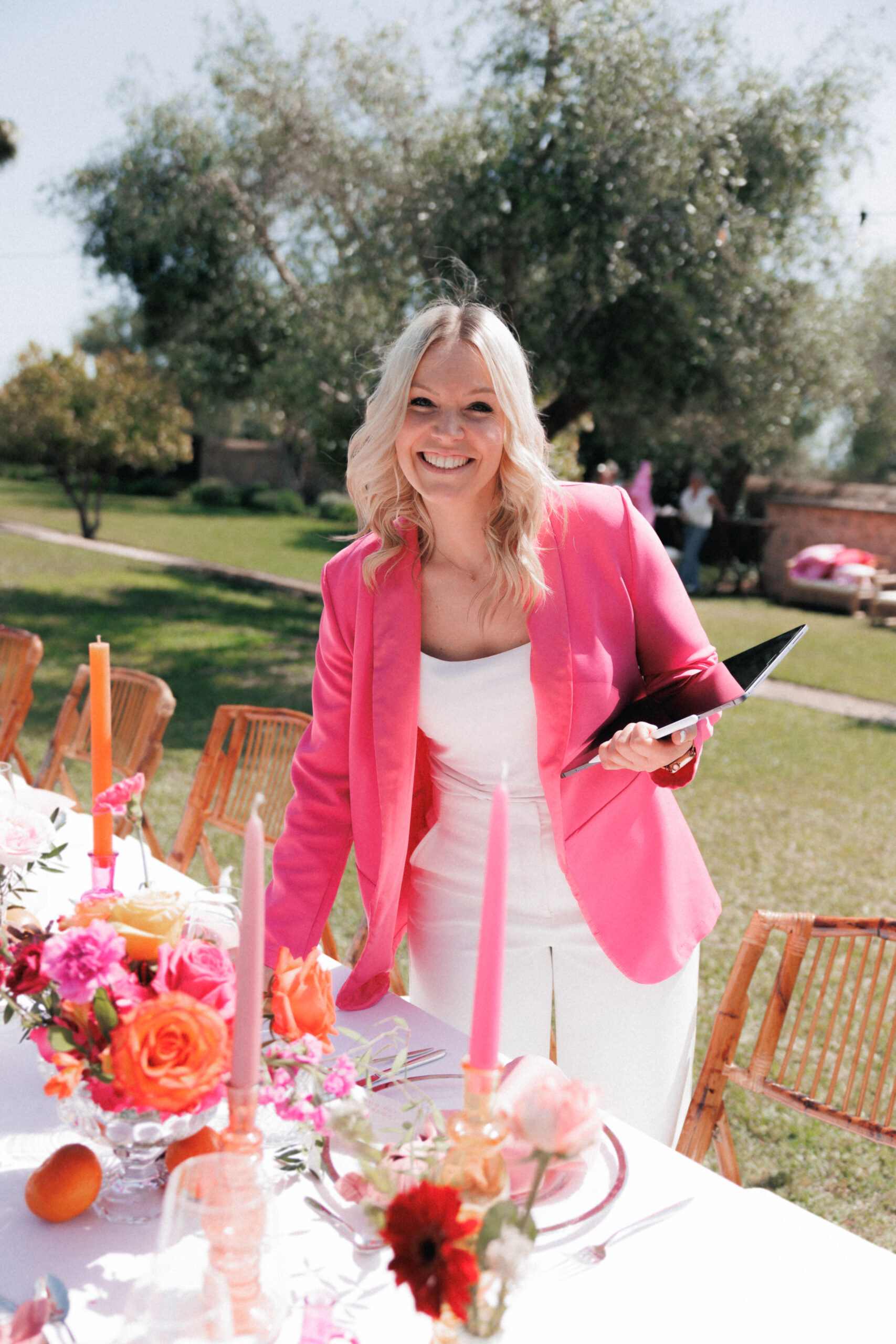 Wedding planner arranging elegant wedding table styling for a luxury destination wedding