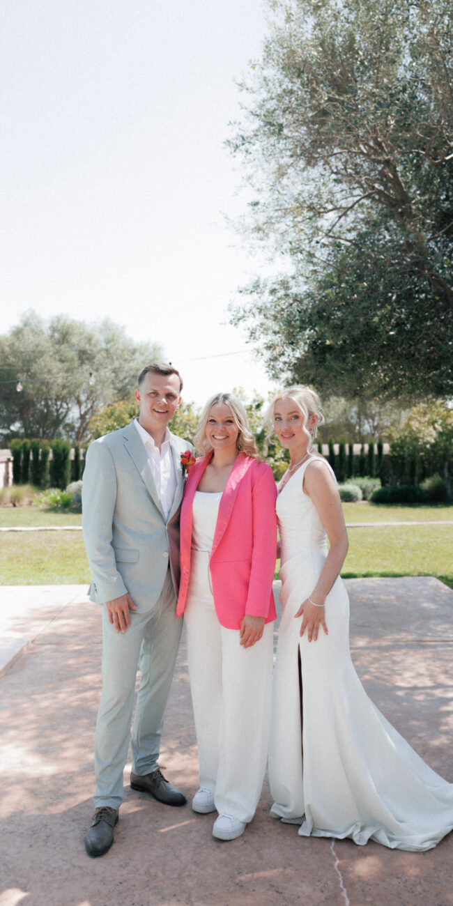 Luxury destination wedding planner with bride and groom during a wedding in Mallorca
