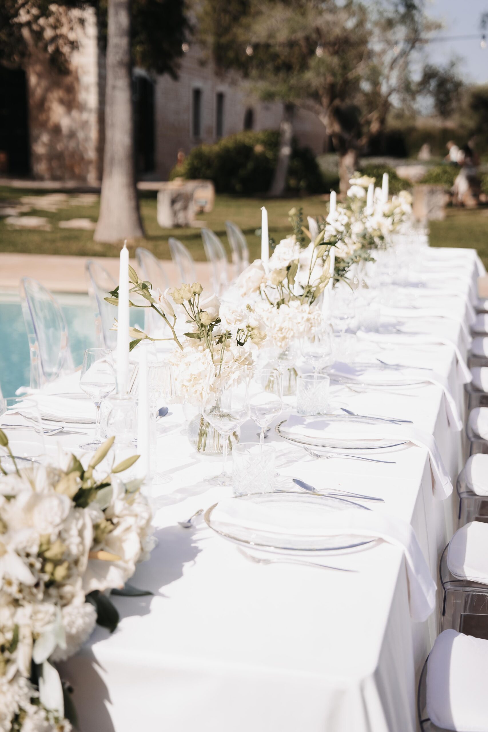 Elegant styled wedding table with luxury floral design in white and neutral tones for a destination wedding in Europe.
